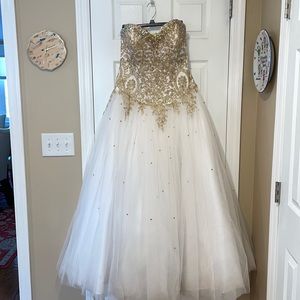 Fiesta gown size 14 for sweet 16 or any occasion. Worn once. Like new.